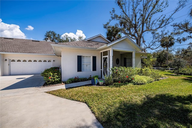 view of front of house with a garage and a front yard