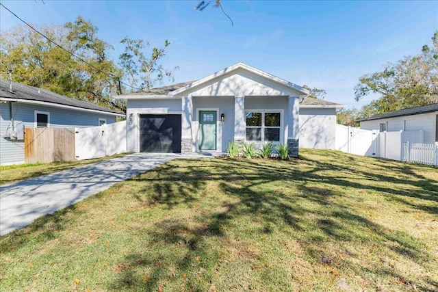 view of front facade with a garage and a front lawn