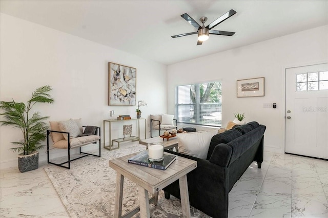 living room featuring plenty of natural light and ceiling fan