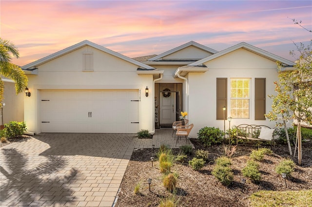 ranch-style home featuring a garage