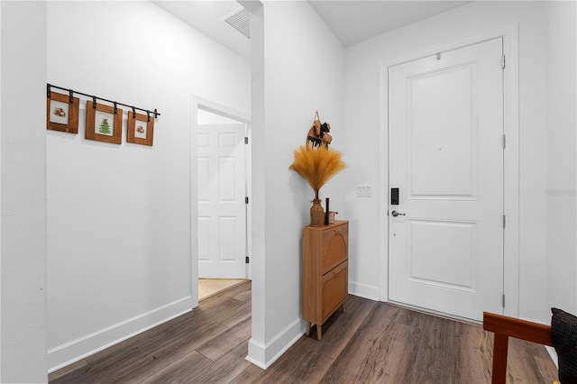 foyer entrance with dark hardwood / wood-style flooring