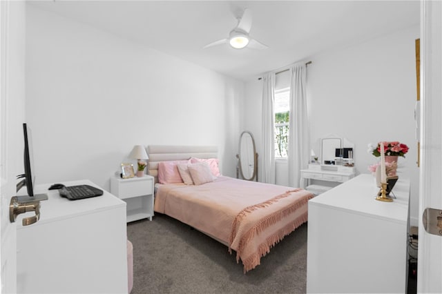 bedroom featuring ceiling fan and dark carpet