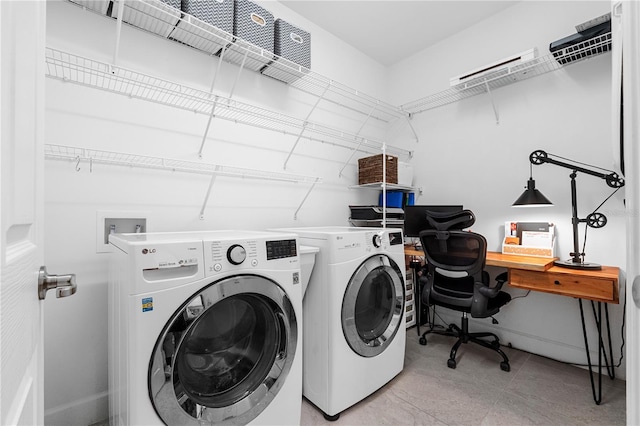 laundry area featuring washing machine and clothes dryer