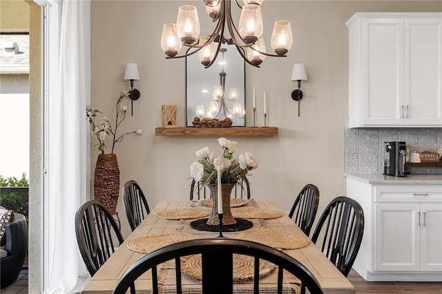 dining space featuring a notable chandelier