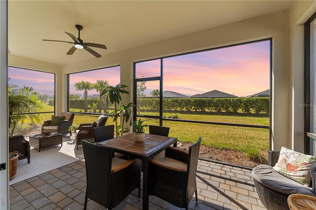 sunroom with ceiling fan