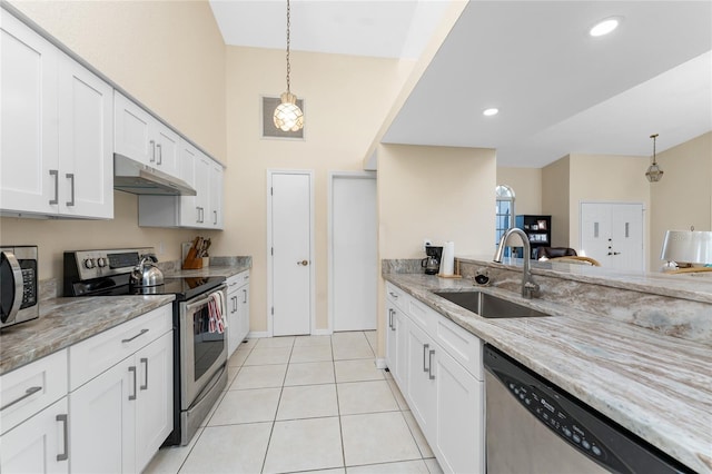 kitchen featuring sink, appliances with stainless steel finishes, hanging light fixtures, light stone countertops, and white cabinets