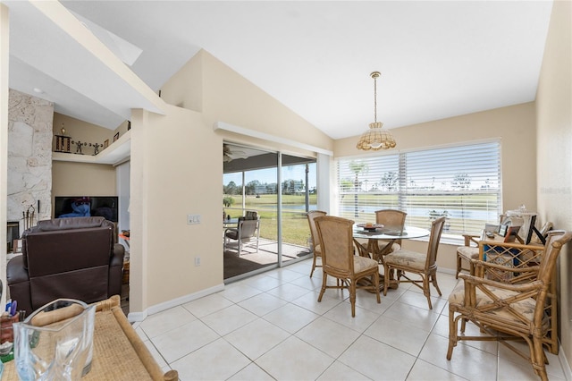 tiled dining space with vaulted ceiling