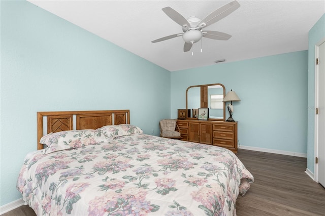 bedroom featuring dark hardwood / wood-style flooring and ceiling fan