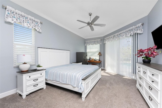 carpeted bedroom with a ceiling fan, baseboards, vaulted ceiling, access to exterior, and crown molding