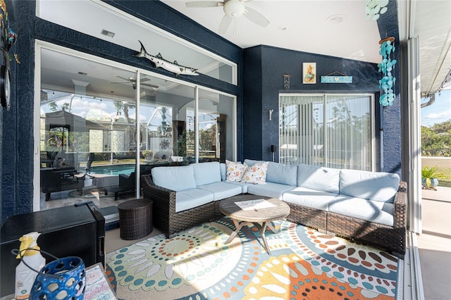 sunroom with visible vents and a ceiling fan