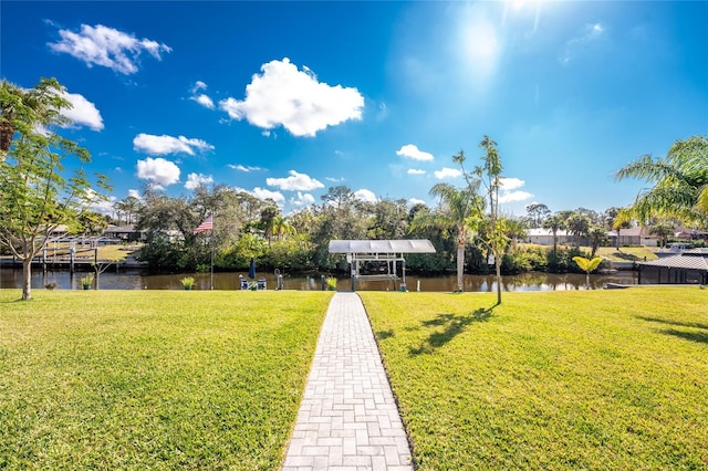 exterior space with a water view and a lawn