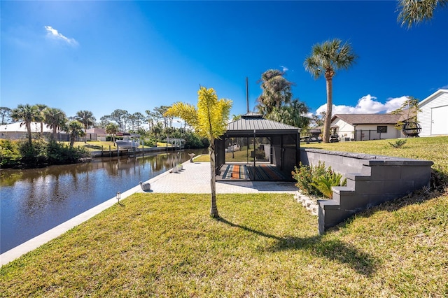 exterior space with a water view and a gazebo