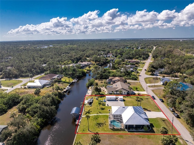 birds eye view of property featuring a residential view and a water view