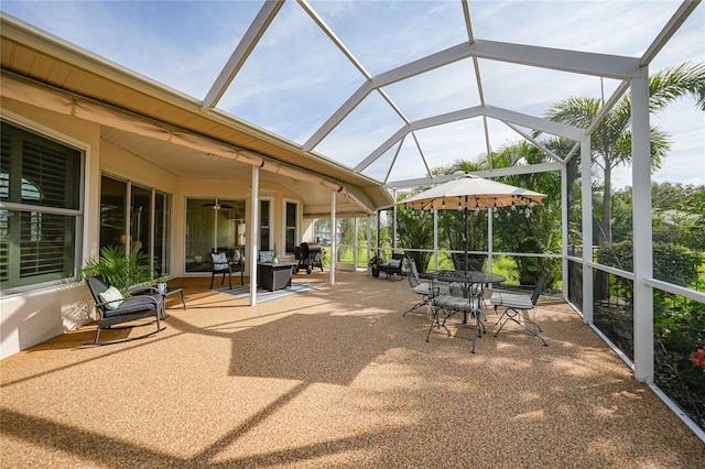 view of patio / terrace featuring a lanai, an outdoor hangout area, and ceiling fan