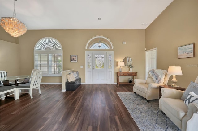 entryway featuring dark hardwood / wood-style flooring and a notable chandelier