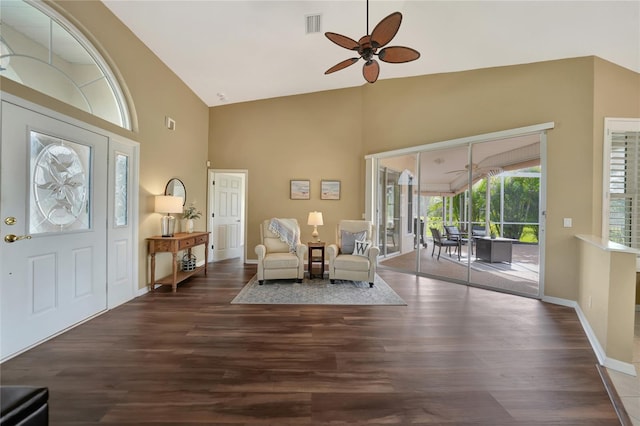 unfurnished room featuring dark wood-type flooring, ceiling fan, and high vaulted ceiling