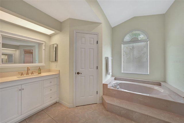 bathroom with tile patterned flooring, vaulted ceiling, separate shower and tub, and vanity