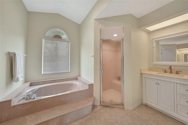 bathroom with independent shower and bath, vanity, lofted ceiling, and tile patterned flooring