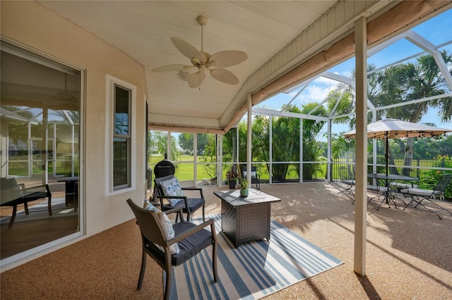 sunroom featuring ceiling fan