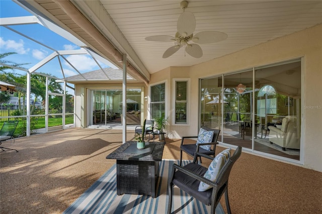 sunroom / solarium with ceiling fan