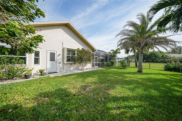 view of yard featuring a lanai