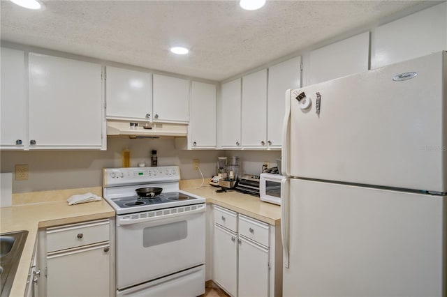 kitchen with white cabinetry, white appliances, and a textured ceiling