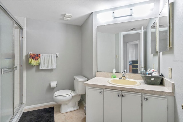 bathroom with vanity, an enclosed shower, tile patterned floors, and toilet