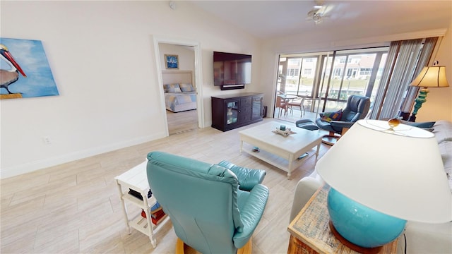 living room with lofted ceiling