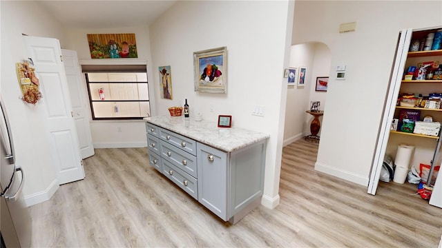 hallway with light wood-type flooring