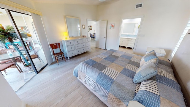 bedroom with light wood-type flooring