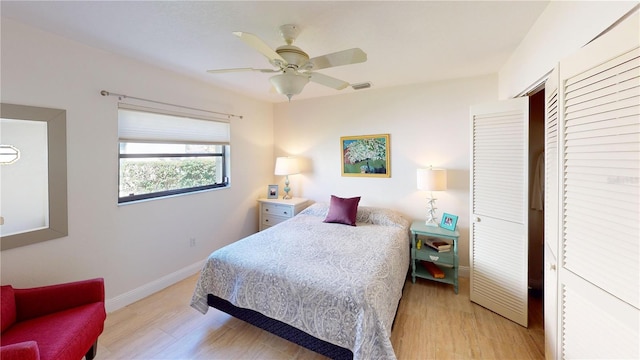 bedroom with ceiling fan and light wood-type flooring