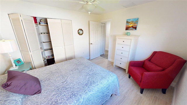 bedroom featuring light hardwood / wood-style floors, a closet, and ceiling fan