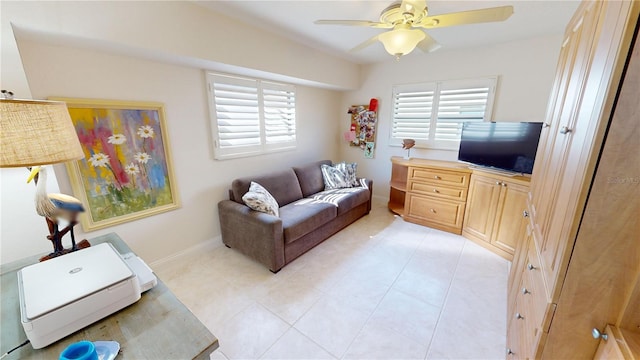 tiled living room with ceiling fan