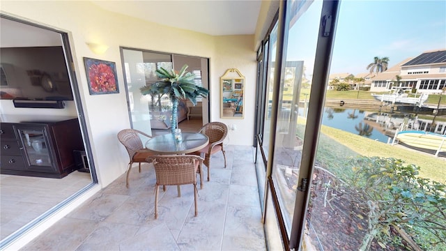 sunroom with a water view