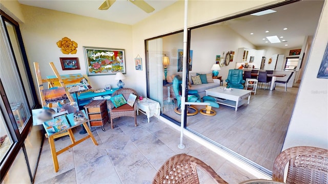 sunroom featuring ceiling fan