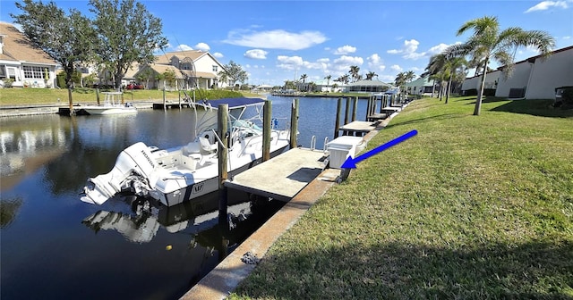 dock area with a water view and a lawn