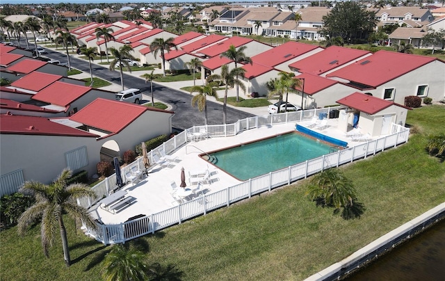 view of swimming pool featuring a patio area and a lawn