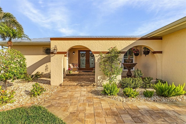 entrance to property featuring french doors