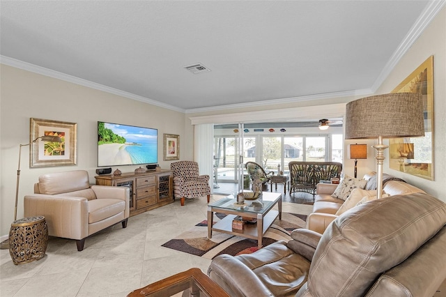 living room with ornamental molding and light tile patterned flooring