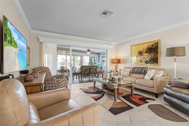 tiled living room featuring crown molding and a textured ceiling