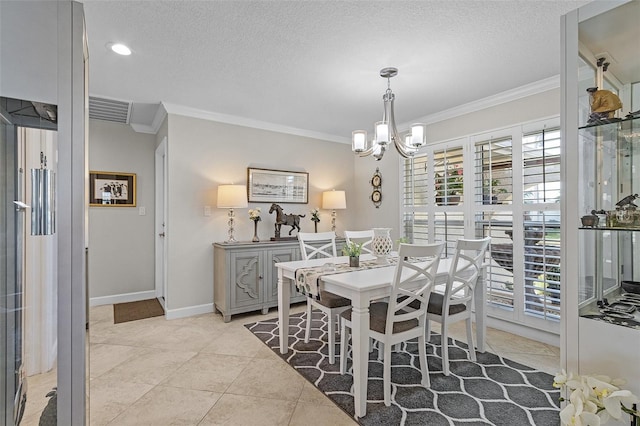 tiled dining room featuring an inviting chandelier, ornamental molding, and a textured ceiling