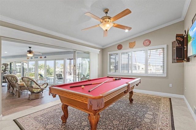 playroom with pool table, vaulted ceiling, ornamental molding, and a healthy amount of sunlight