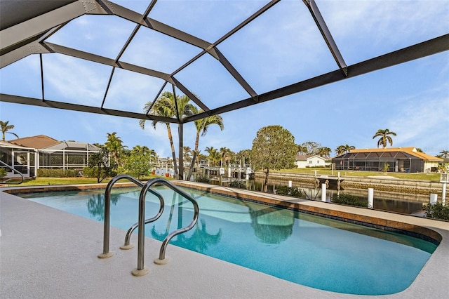 view of swimming pool with glass enclosure