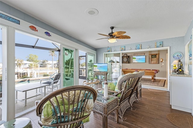 sunroom with pool table and ceiling fan