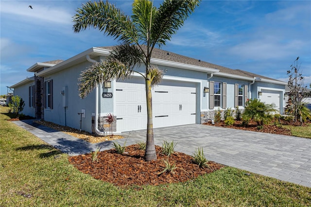 view of front of house with a garage and a front yard