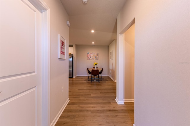 corridor featuring hardwood / wood-style flooring