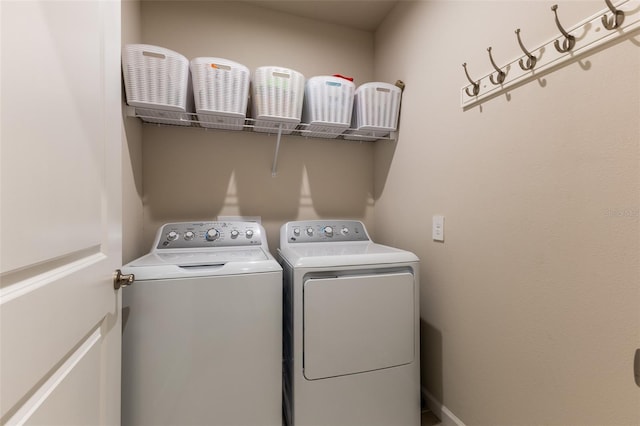 washroom featuring washing machine and dryer