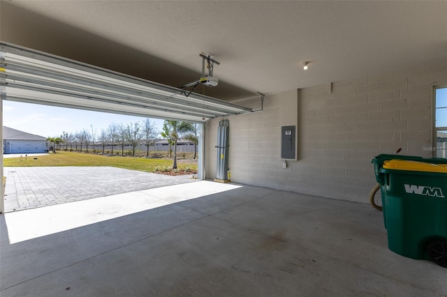 garage featuring a garage door opener and electric panel