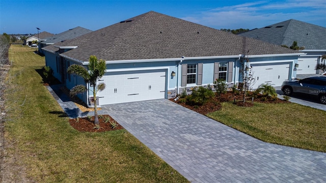 view of front facade with a garage and a front yard