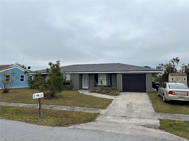 single story home with a garage and a front lawn